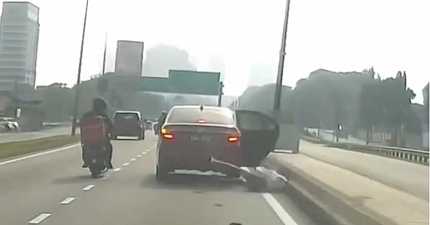 MALAYSIAN TAXI DRIVER UNDER INVESTIGATION AFTER PASSENGER LEAPS FROM MOVING VEHICLE